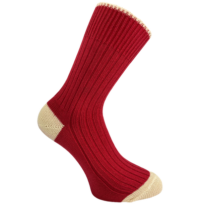 Red sock with cream heel and toe on a white background