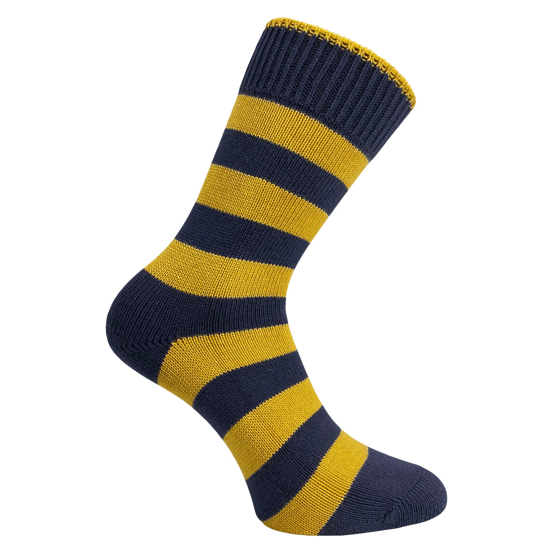 Navy and yellow striped sock on a mannequin foot against a white background
