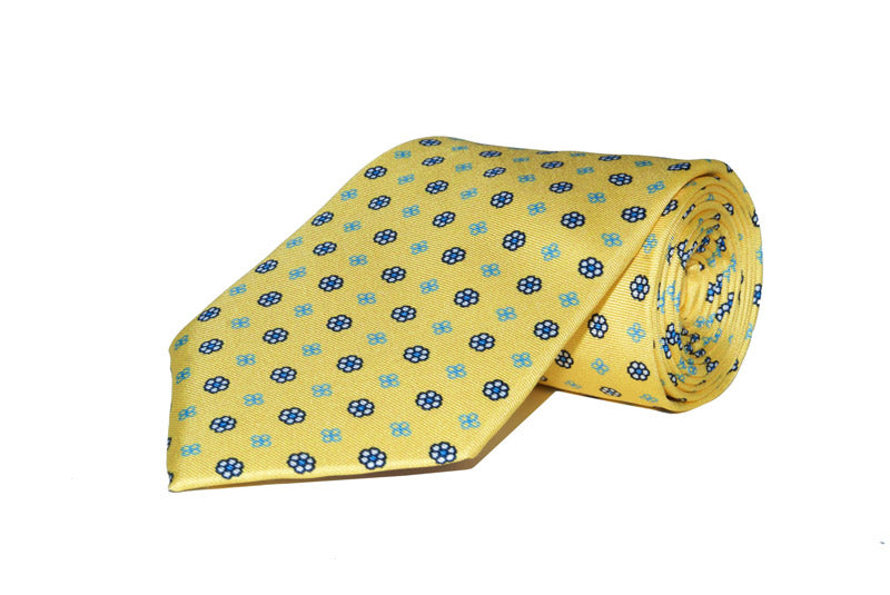 Bright Yellow Tie with Blue Floral Design rolled up - 100% Silk - Hand Made in England